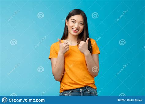 Supportive Cute Friendly Asian Girl Give Thumbs Up And Smiling Cheering For You Congratulate