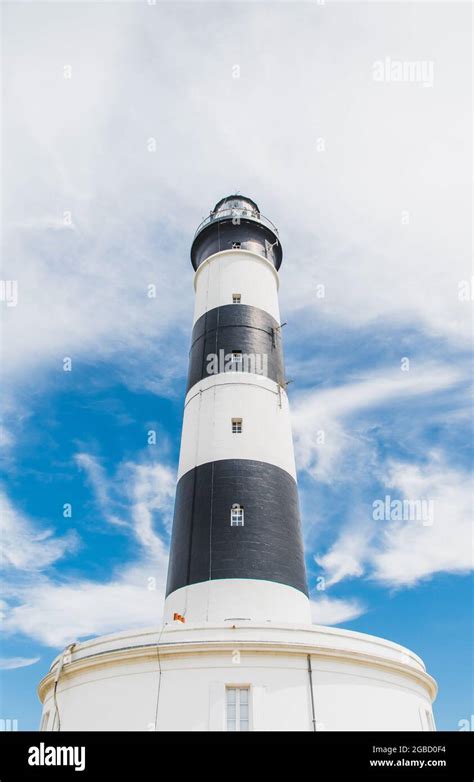 The Chassiron Lighthouse With Black And White Stripes On Blue Sky On