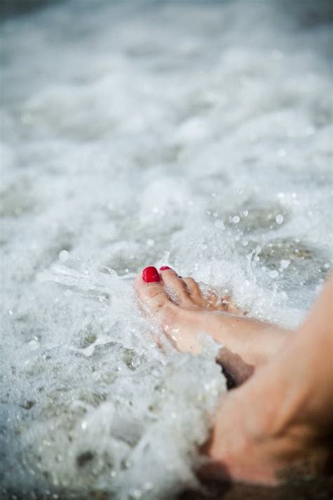 woman feet and water splashing stock image image of beach elegance 15696565