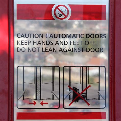 Caution Automatic Doors Keep Hands And Feet Off Do Not L