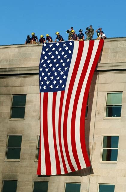 Maybe you would like to learn more about one of these? Stock Photo of Huge American Flag Hanging From the ...