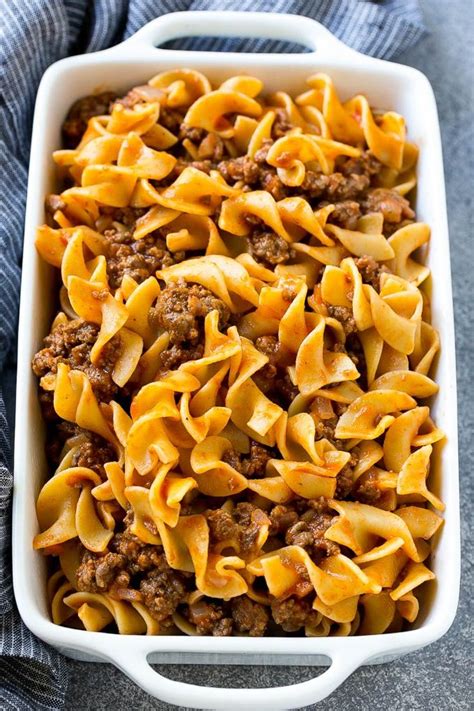 Ground Beef And Egg Noodles Tossed In Tomato Sauce Inside A Baking
