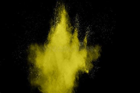 Abstract Yellow Dust Explosion On Black Background Freeze Motion Of