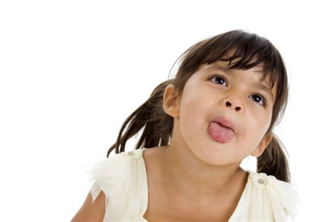Beautiful Little Girl Sticking Her Tongue Out Stock Photo