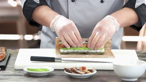 chef-making-a-sushi-roll-man-preparing-japanese-food-stock-video