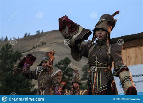 Mongolian Woman In Shaman And Witch Costume Dances On Stage In The