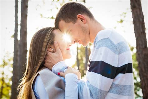 Happy Young Couple In Love Hugging Park Outdoors Date Stock Photo