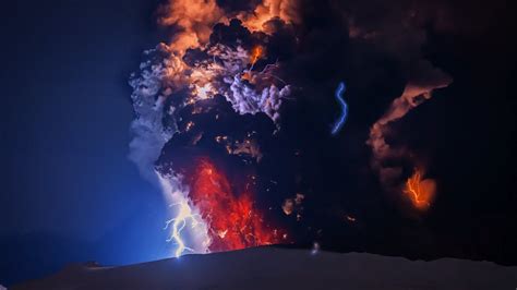 Black And Red Ash Cloud With Blue Flashes Of Lightning