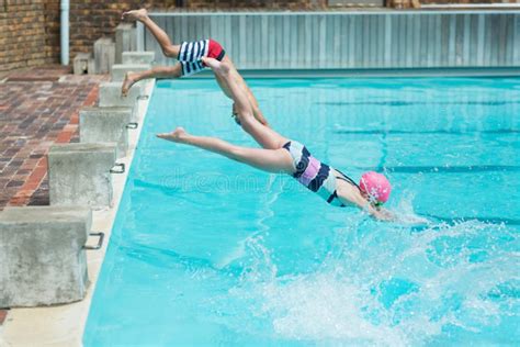 Children Diving In Water At Poolside Stock Photo Image Of Leisure