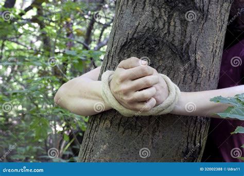 Woman Tied To A Tree In The Forest Stock Photo Image Of Sign