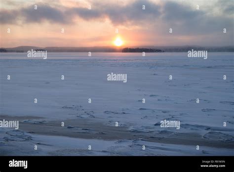 Frozen And Snowy Lake And Sunrise In Tampere Finland In The Winter