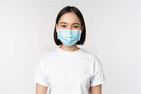 Health And Covid Pandemic Concept Smiling Asian Girl Wearing Medical