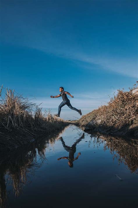 Person Man Jumping Over Stream Malaysia Image Free Stock Photo