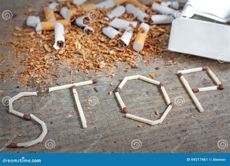 Stop Smoking Background With Broken Cigarettes And Tobacco Stock Image