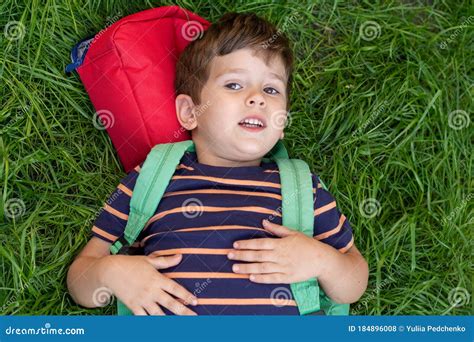 Happy First Day Of School Adorable Schoolboy With Backpack Lies On