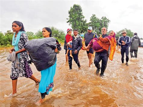 Scores dead, thousands evacuated as flood, rains hit ...