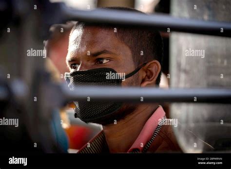 An Indian Homeless Man Sits In A Bus As He Is Being Evicted With Other