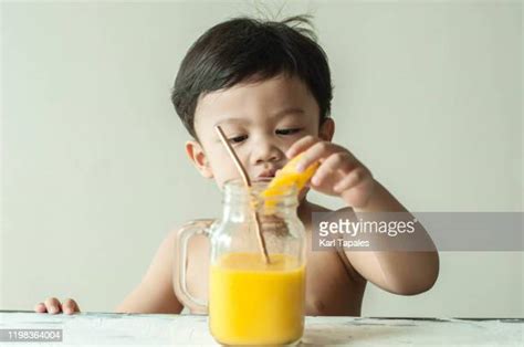 Kids Eating Mangoes Photos And Premium High Res Pictures Getty Images