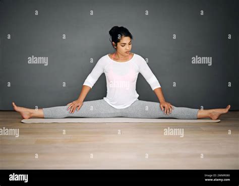 Stretching Keeps Her Strong And Supple An Attractive Young Woman Doing