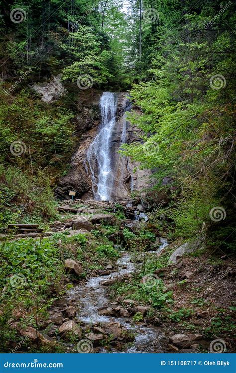 Waterfall And Creek Between Rocks In A Mountain Forest Stock Image