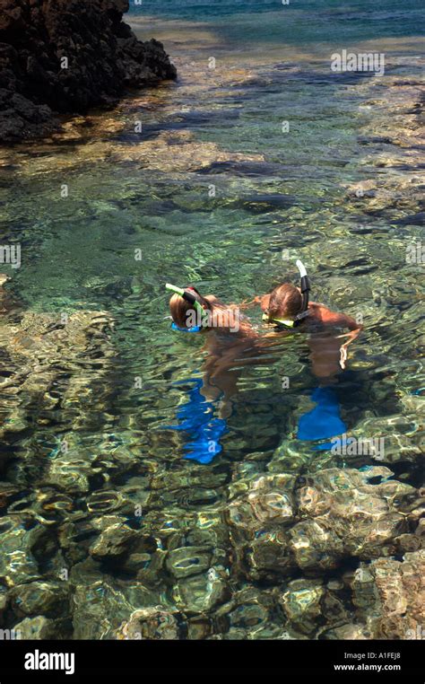 Mother And Daughter Looking At Sea Life Maui Stock Photo Alamy