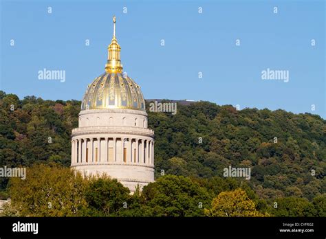 The Golden West Virginia State Capital Dome Towering Above The Trees On