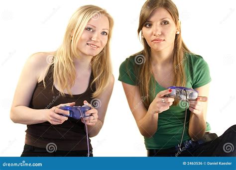 Duas Meninas Que Jogam Os Jogos Video Foto De Stock Imagem De Menina