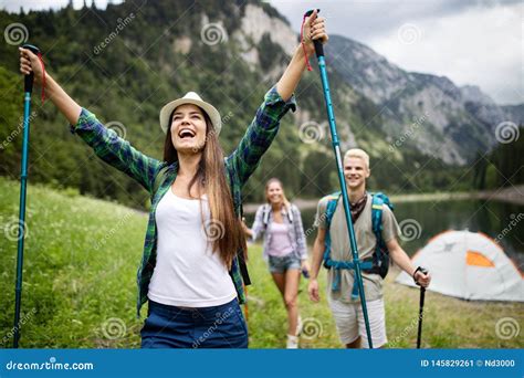 Group Of Friends Hikers Walking On A Mountain At Sunset Stock Image
