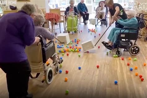 nursing home residents play life size game of hungry hungry hippos while under lockdown