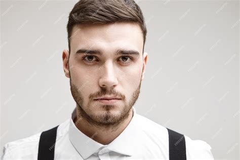 Free Photo Studio Shot Of Serious Young Unshaven Caucasian Male