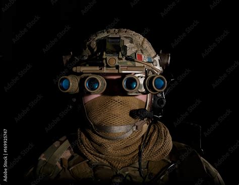 soldier in military uniform with night vision goggles on background of dark wall 21 ภาพถ่ายสต็อก