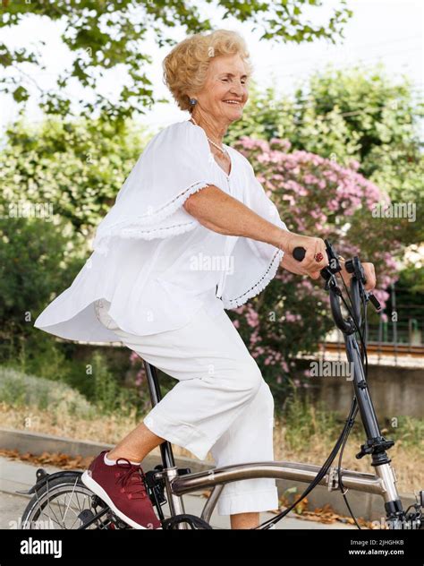 Mature Woman Cycling Stock Photo Alamy