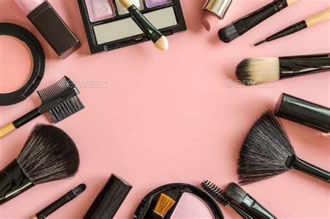 Set Of Make Up Brushes And Cosmetics On Pink Background Makeup