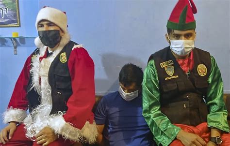 Peruvian Undercover Cops Disguise As Santa Elf To Arrest Drug Dealers