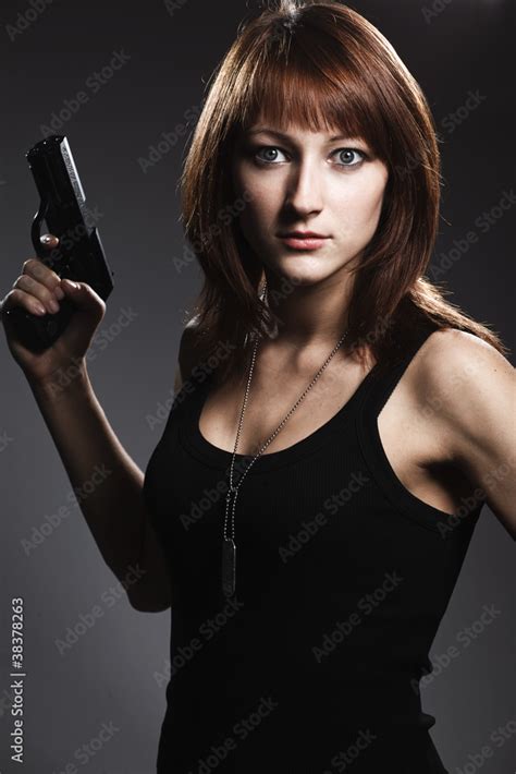 Sexy Woman Holding Gun On Gray Stock Photo Adobe Stock