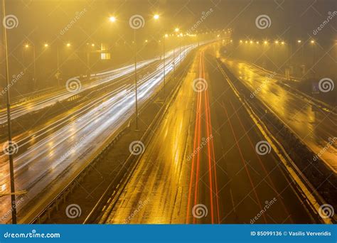 Speed Traffic Light Trails On Motorway Highway At Night Stock Photo