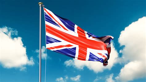 Various World Flags Flying On Flagpoles On A Background Of The Sky And