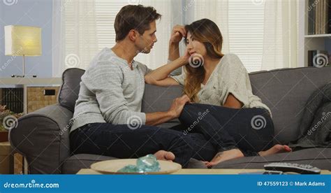 Mixed Race Couple Talking On Couch Stock Image Image Of Home Mixed 47559123