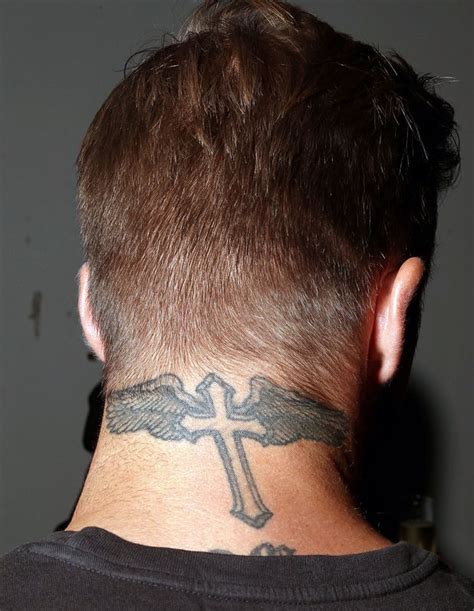 Beckham is a religious man and got this winged cross in 2003 following his transfer to. David Beckham - David Beckham's tattoos - Digital Spy