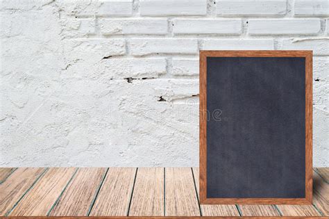 chalkboard wood frame blackboard sign menu  wooden table   brick background stock