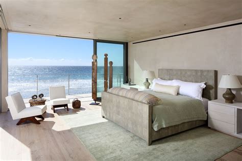 A Bedroom With An Ocean View Is Shown