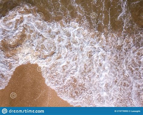 Aerial View Of The Sandy Beach And Stormy Sea With Amazing Waves