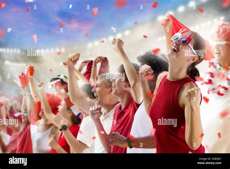 Football Supporter On Stadium In Red And White Shirt Happy Fans On