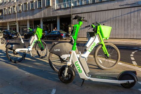 Modern Lime Electric Bike And Electric Scooter On A Street In London