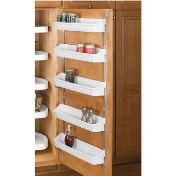 Organize under the sink in the bathroom or kitchen, or in a cleaning in the kitchen, a set of these cabinet door organizers can hold tin foil and plastic wrap boxes, paper towels, container lids, etc. Rev-A-Shelf Door Mounted Spice Racks | KitchenSource.com