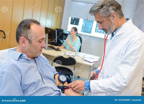 Doctor Taking Man S Blood Pressure Stock Photo Image Of Rate Blood