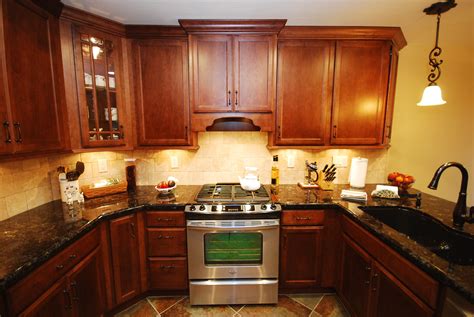 They did not have the necessary trim pieces and items available to do what the homeowner wanted, but she liked the particular color and. StarMark maple chestnut with volga blue granite | Kitchen ...