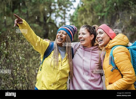 Multiracial Women Having Fun During Trekking Day In To The Wood Focus On Right Woman Face