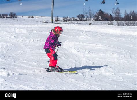 Winter Leisure Activities In Mountains Skiing Down The Slope Stock Photo Alamy