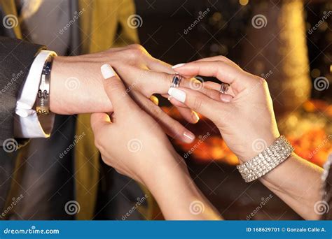 Hands Of The Bride And Groom Placing Wedding Rings Stock Image Image Of Groom Celebration